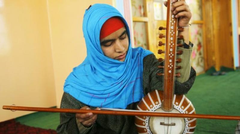 Kashmiri teenager Shabnam Bashir first took up classical Sufi music before she convinced her family to let her pursue it. (Photo: AFP)