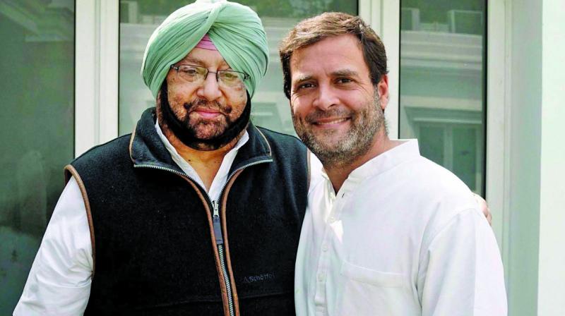 Punjab Congress president Captain Amrinder Singh with party vice-president Rahul Gandhi in New Delhi on Tuesday. (Photo: PTI ) Punjab Congress president Captain Amrinder Singh with party vice-president Rahul Gandhi in New Delhi on Tuesday. (Photo: PTI )