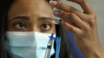US opens COVID boosters to all adults, urges them for 50+
