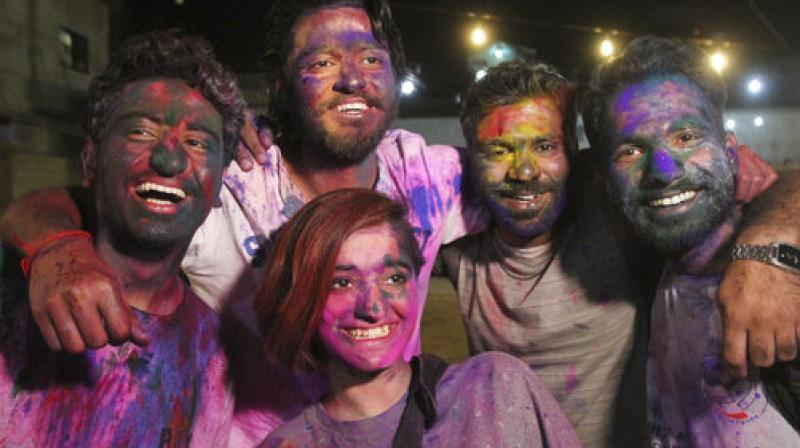 Celebrating colours of unity on Holi across borders