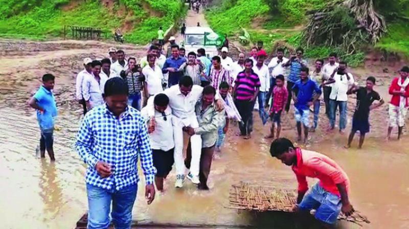 BJD MLA Manas Madkami being carried by supporters. BJD MLA Manas Madkami being carried by supporters.