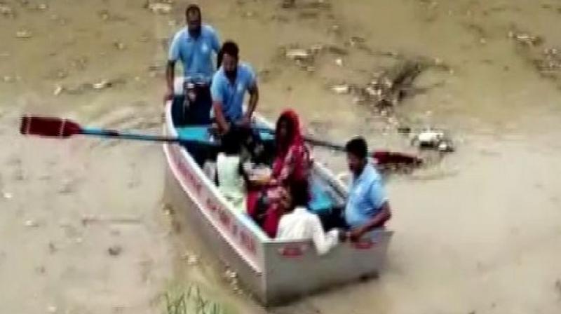 The water level swells following the release of 1.43 lakh cusec water from Haryana. (Photo: ANI)