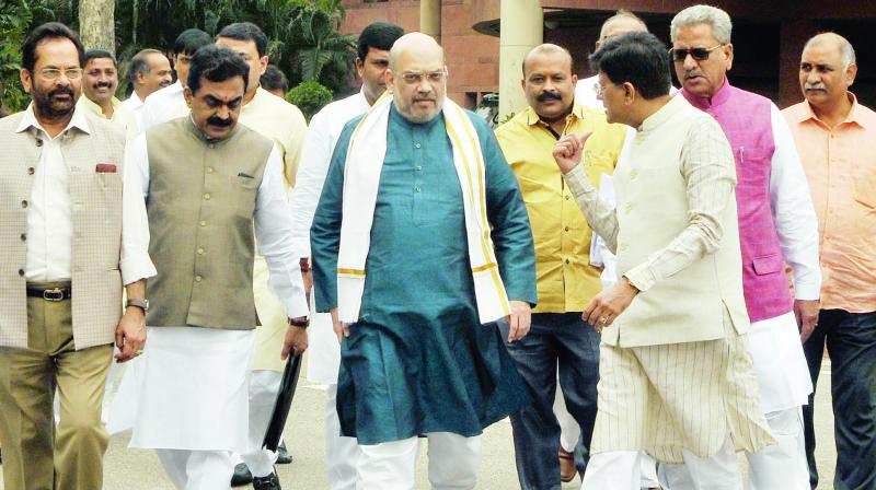 BJP chief Amit Shah with Union minister Piyush Goyal outside Parliament House. (Photo: Asian Age) BJP chief Amit Shah with Union minister Piyush Goyal outside Parliament House. (Photo: Asian Age)