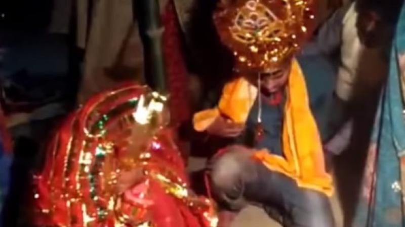 Video clips from the wedding show Vinod Kumar, the forced groom, being thrashed and compelled to perform wedding rituals in Patnas Pandarak area. (Screengrab)