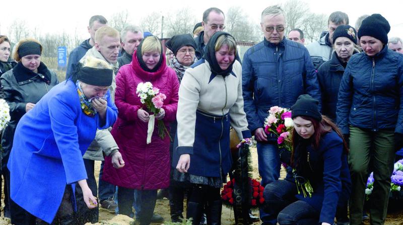 People attend the funeral of metro blast vicitm Irina Medyantseva in Leningrad, Russia. (Photo: AFP)