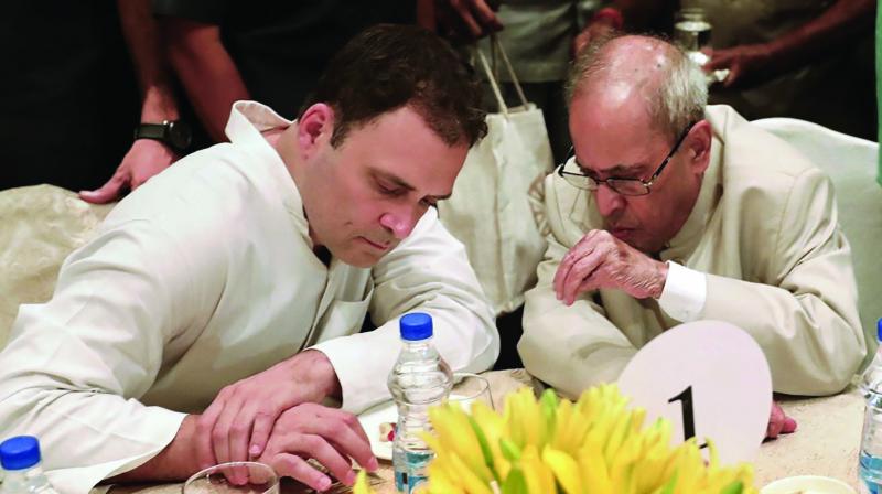 Former President Pranab Mukherjee and Rahul Gandhi during the iftar party hosted by the Congress president in New Delhi. (Photo: PTI)