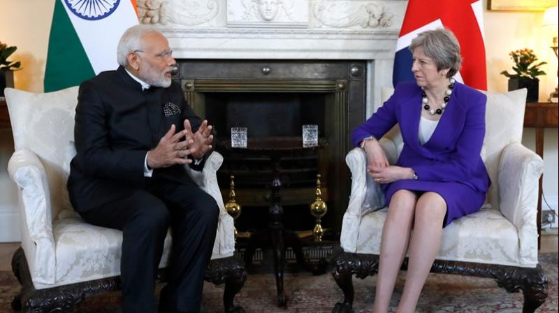 According to a report, a spokesperson of 10 Downing Street said British PM Theresa May and PM Modi had discussed cooperation between the two countries on legal matters. (Photo: PTI)