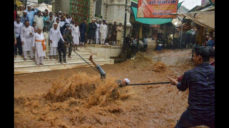 In pictures: Monsoon drowns India