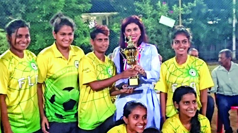 The Leaders FC players receive the trophy from Dr Cheryl Misquitta, president, Bandra Gymkhana.