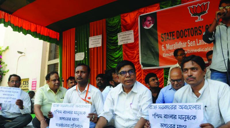 State BJP doctor cell activists participate in a demonstration on rotten meat racket at Elgin road on Saturday. (Photo: Asian Age)