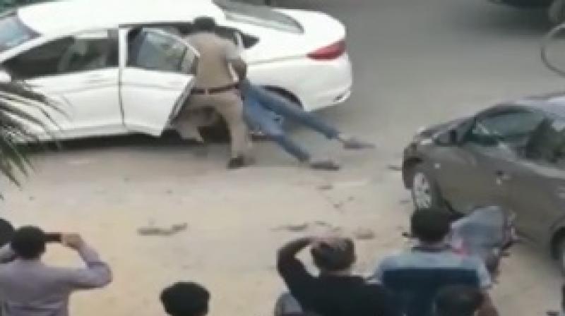 The accused could be seen dragging around the judges son in a bid to shove him inside the car. (Photo: ANI screengrab)