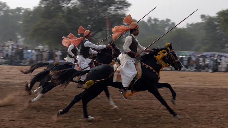 Pakistan: Horse riders show off their skills during Kot Fateh Khan mela