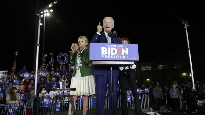 Democratic presidential candidate former Vice President Joe Biden speaks, next to his wife Jill during a primary election night rally Tuesday. AP Photo