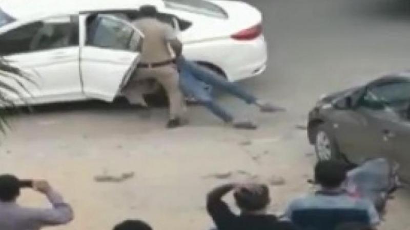 In the video shared by ANI, the gunman shot the wife first and then the son. He tried to drag him in the car. After shooting, he left them on the road and drove away in the same car. (Photo: ANI | Screengrab)