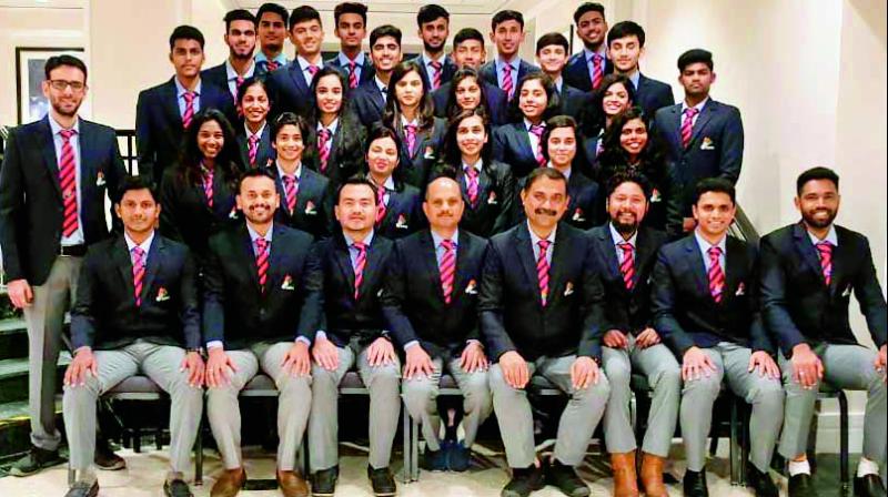 The Indian squad for the World Junior Badminton Championship being held at Markham in Canada, are all smiles in this team photo.
