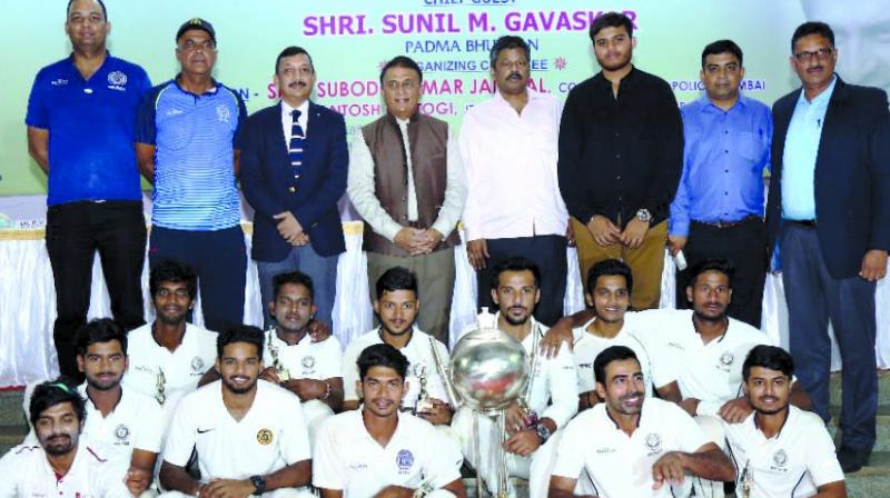 The victorious Parkhophene Cricketers proudly pose with the glittering Police Shield Trophy along with Chief Guest, former India captain Sunil Gavaskar, S.K. Jaiswal, Commissioner of Police, Greater Mumbai, Dr. P.V. Shetty, founder of Parkhophene Cricketers and Deepak Patil, Joint Hon. Secretary, Mumbai Police Gymkhana.