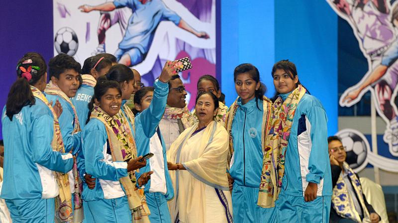 Sporspersons take a selfie with chief minister Mamata Banerjee during the award and prize distribution ceremony at Netaji Indoor stadium on Monday. (Photo: Abhijit Mukherjee)
