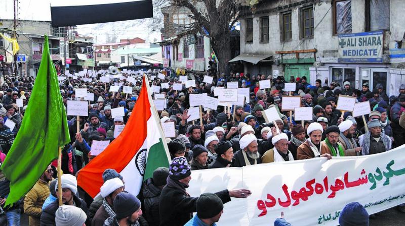 Thousands of people on Friday marched on the roads of Kargil to demand reopening of traditional cross-LoC Kargil-Skardu route on  humanitarian groundsâ€.