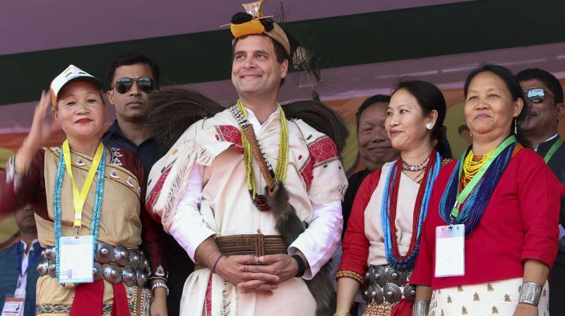 Congress chief Rahul Gandhi with party supporters during a public meeting in Itanagar on Tuesday. (Photo: PTI)