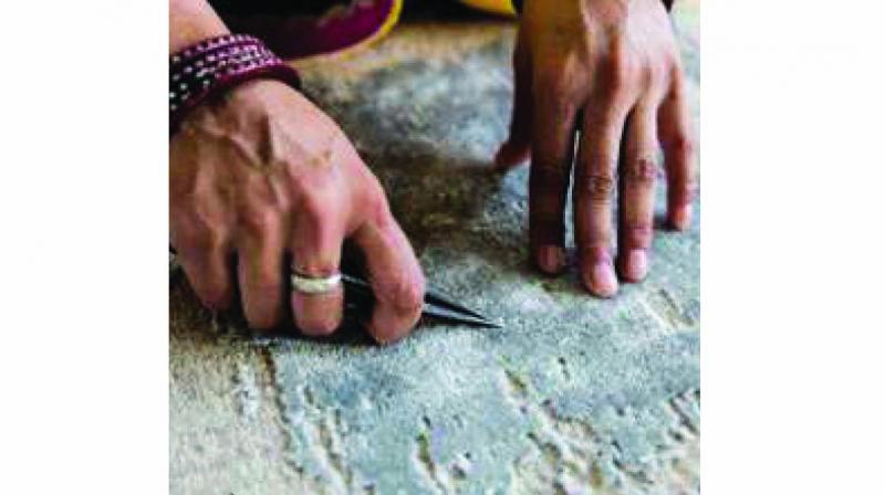 Carpets being woven. Carpets being woven.