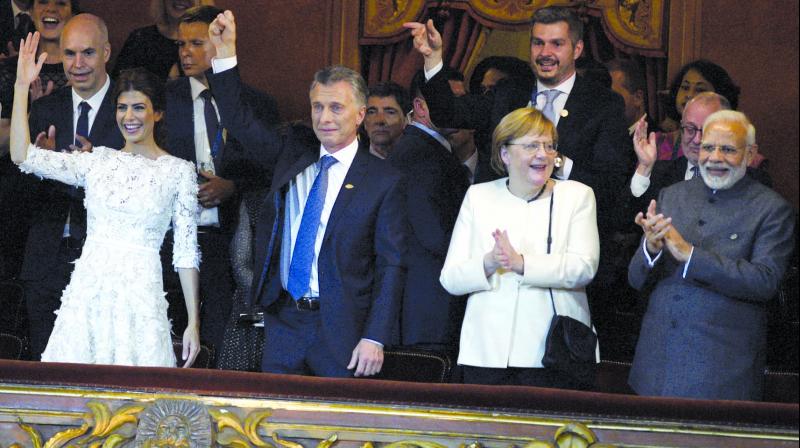 Prime Minister Narendra Modi with Argentinas President Mauircio Macri and German Chancellor Angela Merkel during an event in Buenos Aires. (Photo: AFP)