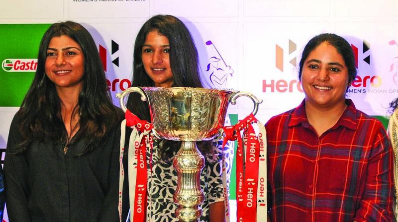 Indian golfers Tvesa Malik (from left) Neha Tripathi and Amandeep Drall pose with Indian Open trophy in New Delhi on Thursday. (Photo: BIPLAB BANERJEE)
