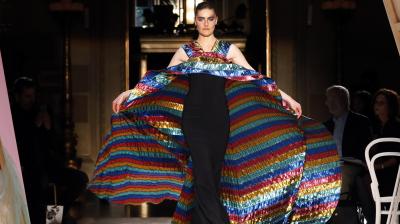 This Christian Siriano dress had a plain black, figure-hugging design with a multi-coloured cape billowing behind it. (Photo: AP)