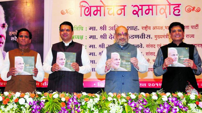 The ministers launching the book. (Photo: Debasish Dey) The ministers launching the book. (Photo: Debasish Dey)
