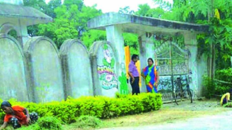 Students cleaning the sewer and doing gardening work at their teachers house in Odishas Angul district. (Photo: Asian Age)