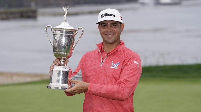 Last years US Open winner Gary Woodland with the trophy. AP Photo