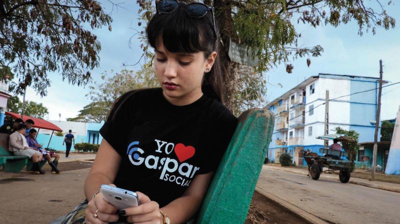 An activist of the Gaspar social network uses her cell phone to go online at a park in Gaspar, a small town in Ciego de Avila province in central Cuba. (Photo: AFP) An activist of the Gaspar social network uses her cell phone to go online at a park in Gaspar, a small town in Ciego de Avila province in central Cuba. (Photo: AFP)