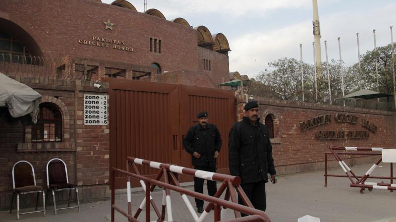 Guards stand outside the Gadaffi cricket stadium, which will host the final of the Pakistan Super League in Lahore. (Photo: AP)