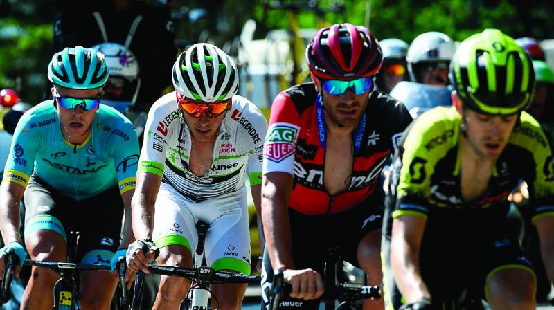 Denmarks Michael Valgren (from left), Warren Barguilof France, Italys Damiano Caruso and Spains Mikel Nieve ride in the last ascent during their breakaway of the eleventh stage. (Photo: AFP )