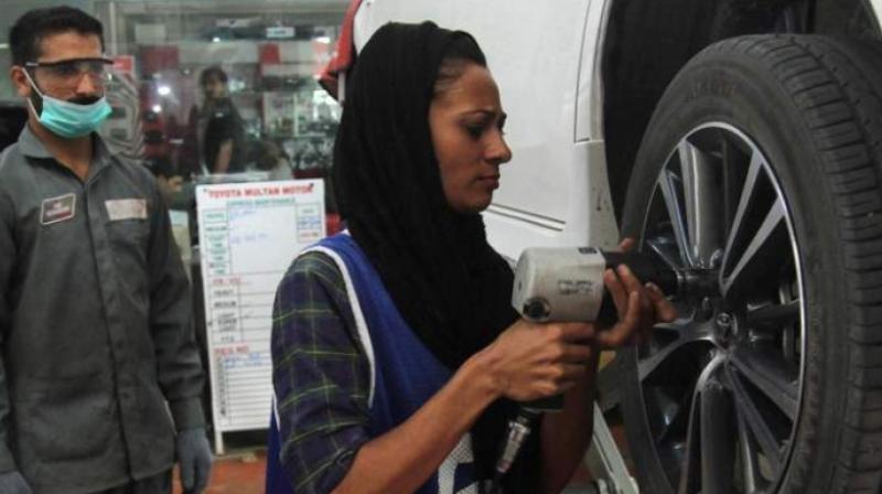 The 24-year-old spent years overcoming entrenched gender stereotypes and financial hurdles en route to earning a mechanical engineering degree and netting a job with an auto repairs garage in the eastern city of Multan. (Photo: AFP)