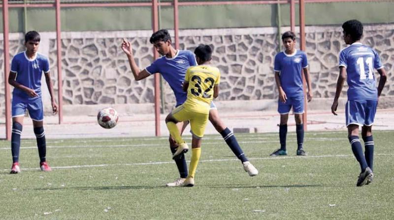 Young footballers seen in action during the initial round of matches. Young footballers seen in action during the initial round of matches.
