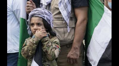 Far from being settled, Afghanistan is perilously poised. Yasif Nazari, 6, leans on a flag pole as he wears an Afghanistan military uniform as he listens to speakers at a rally to support the Afghan government  Representational Image. (AP)