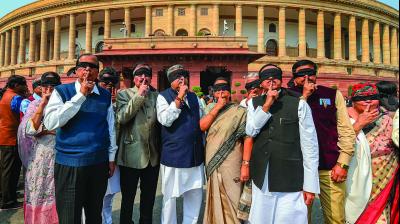 Trinamul Congress leaders protest over Delhi violence at Parliament during the ongoing Budget Session in New Delhi on Monday. (Photo: PTI)