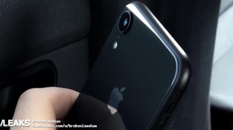 The frame is finished in a matte shade, with the slider for profiles and one of the volume rocker buttons visible.