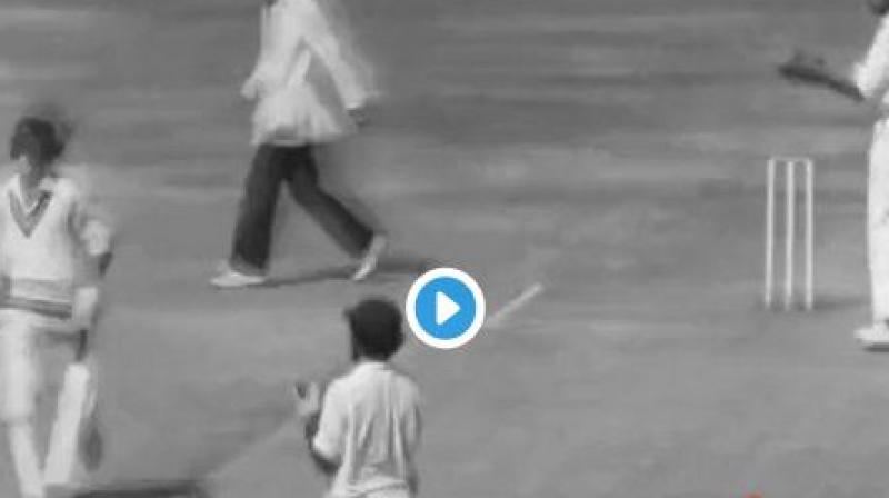 A woman, wearing a black saree, went running onto the cricket pitch. (Photo: Twitter) A woman, wearing a black saree, went running onto the cricket pitch. (Photo: Twitter)