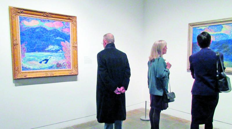 Visitors look at paintings from the Marsden Hartleys Maine show at The Met Breuer Museum in New York.( Photo: AP) Visitors look at paintings from the Marsden Hartleys Maine show at The Met Breuer Museum in New York.( Photo: AP)