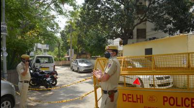  Police personnel stand guard at Model Town police colony, identified as a COVID-19 hotspot, during the nationwide lockdown to curb the spread of coronavirus, in New Delhi. PTI Photo