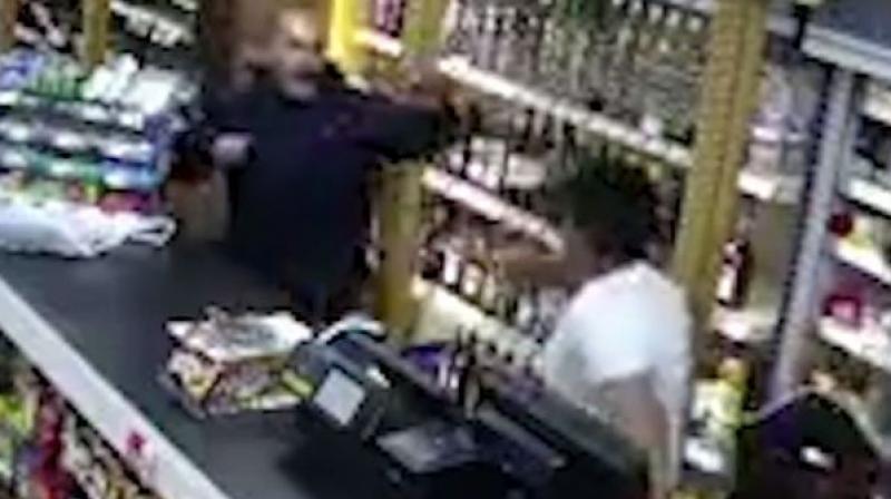 With his teenage son by his side, Velji attempted to fend off his attacker with the spirit bottle before falling to the ground. (Photo: Screengrab)