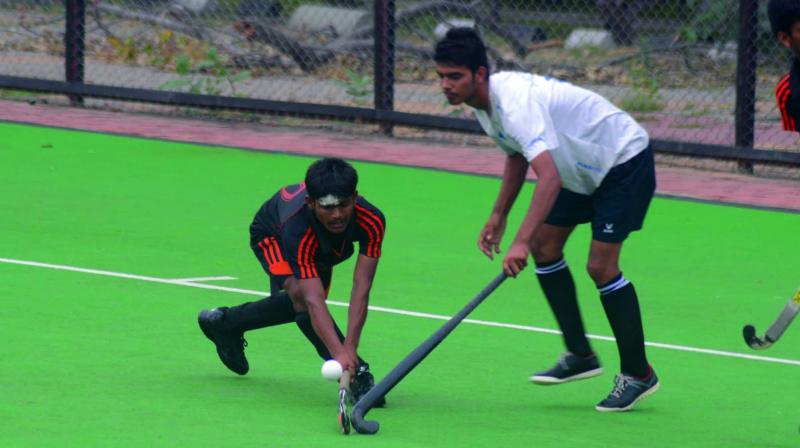 Action from the semi-final between VSA Senior Secondary School, Khera Garhi, and Government Boys Senior Secondary School, Ranikhera, of the Nehru-Dhyan Chand Cup hockey tournament for Delhi schoolboys (U-15) on Thursday. The Khera Garhi boys won 11-1.