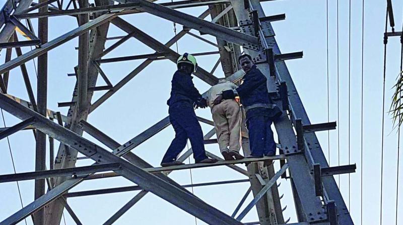 Firemen rescued Gopal Mendha from the tower.