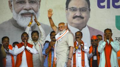 Prime Minister Narendra Modi with Chhattisgarh Chief Minister Vishnu Deo Sai and Deputy Chief Ministers Arun Sao with Vijay Sharma and others during a public meeting ahead of the Lok Sabha elections, at Chhote Aamabal in Bastar district, Monday, April 8, 2024. (PTI Photo)