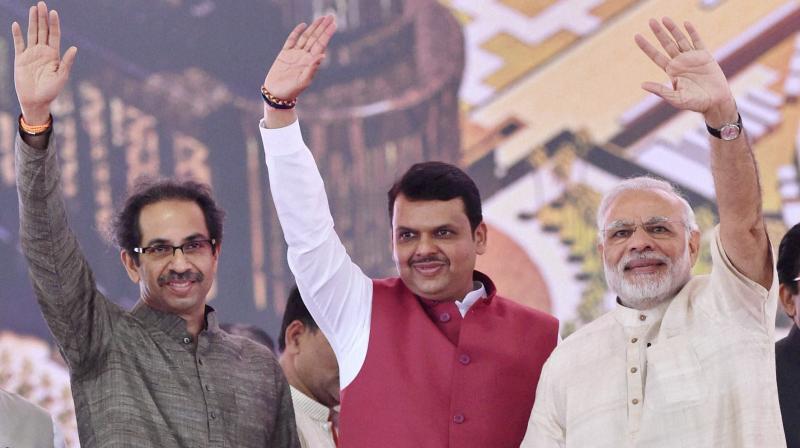 Prime Minister Narendra Modi along with Maharashtra CM Devendra Fadnavis and Shiv Sena President Uddhav Thackarey. (Photo: PTI)