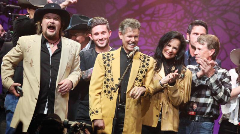 Travis Tritt (left to right), Michael Ray, Randy Travis, Mary Travis and Ricky Traywick appear on stage at the 1 Night. 1 Place. 1 Time.: A Heroes and Friends Tribute to Randy Travis in Bridgestone Arena. (Photo: AP) Travis Tritt (left to right), Michael Ray, Randy Travis, Mary Travis and Ricky Traywick appear on stage at the 1 Night. 1 Place. 1 Time.: A Heroes and Friends Tribute to Randy Travis in Bridgestone Arena. (Photo: AP)