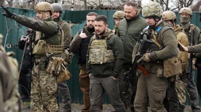 Ukrainian President Volodymyr Zelenskyy examines the battle site in Bucha. (AP File Photo)