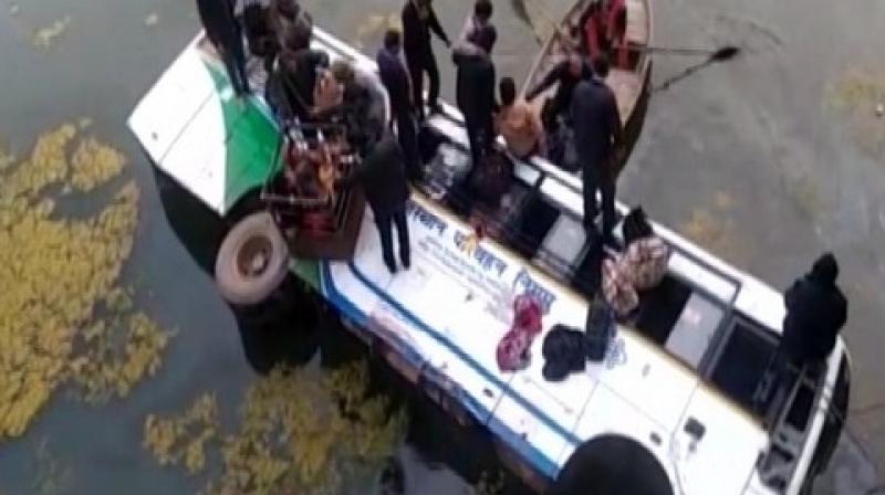 Rajasthan Roadways bus plunged into a drain on Tuesday morning on NH-12 near Chaksu. (Photo: ANI)