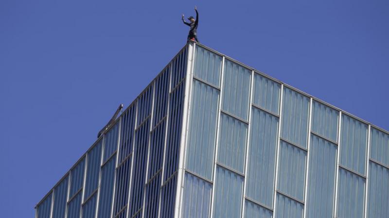 He was questioned by police on reaching the top, but was released without charge. (Photo: AP)